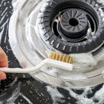 Gas range cleaning brush