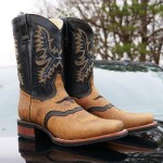 Men's brown Martin boots with leather stitching and binding