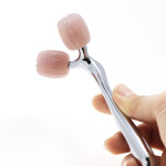 Lift the compact metal roller massage stick essence into the thin face artifact.